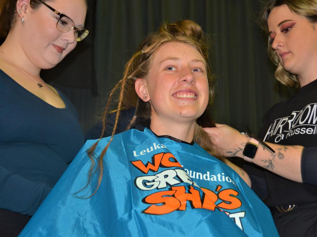 At the St Joseph's College 2023 World's Greatest Shave event is student Emily Chandler getting her hair cut by her support crew and hairdresser Natalie Schmidt from the Hair Room on Russell. Picture: Rhylea Millar