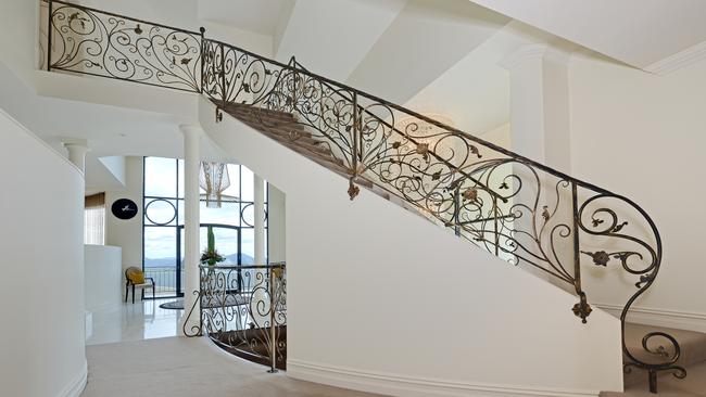 The elegant stairway of the Sandy Bay home. Picture: SUPPLIED