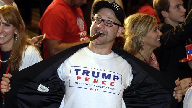 Jake Viano shows his support for President-elect Donald Trump at the Colorado Republican election night party Wednesday, Nov. 9, 2016, in Greenwood Village, Colo. (AP Photo/Jack Dempsey)