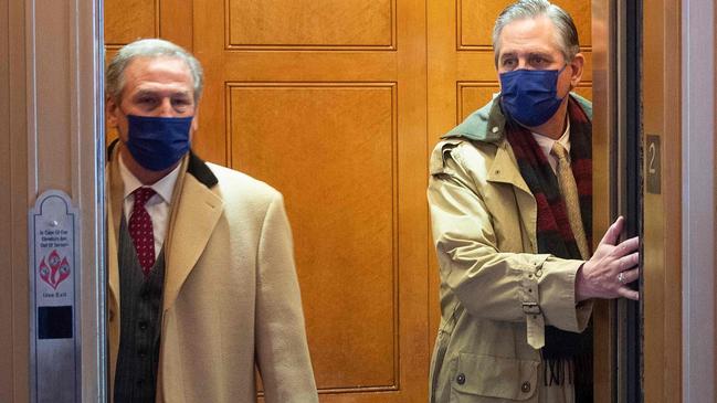 Lawyer Bruce Castor Jr, (R) a member of Donald Trump's legal team arrives at the Capitol. Picture: AFP.