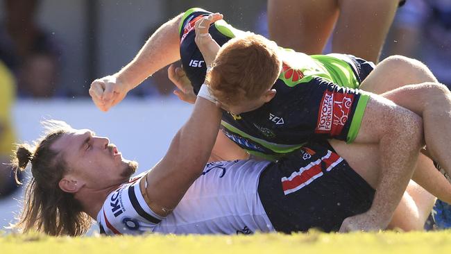 Angus Crichton of the Roosters brawls with Corey Horsburgh of the Raiders in a trial match. Photo: Mark Evans/Getty Images