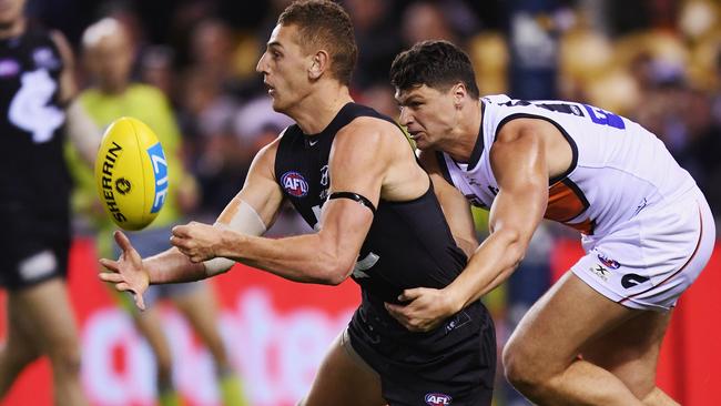 Liam Jones leads Jon Patton to the ball. Picture: Getty Images