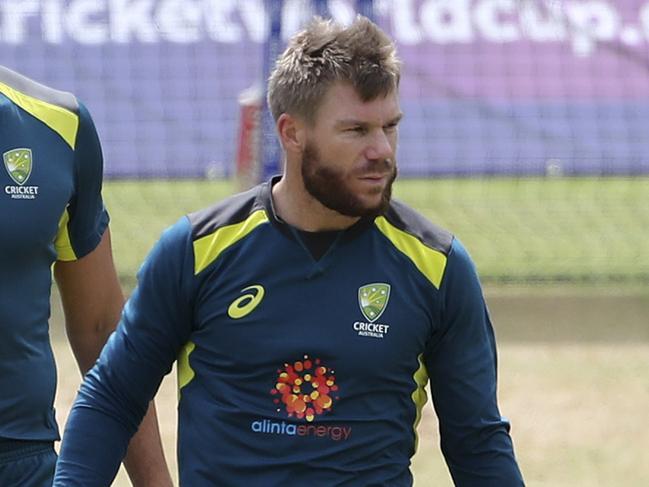 A rattled David Warner leaves the nets last Saturday after his shot knocked Plaha out. Picture: AP