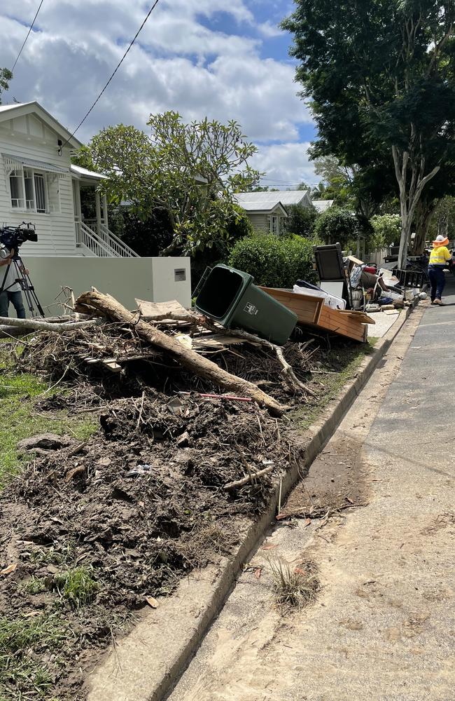 The "Quandong Flats'' verge was piled high with ruined household goods, from end to end.