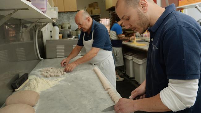 Tony and Rob Cavallaro make cannoli.