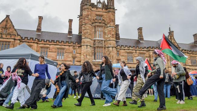 Members of the Australian-Palestinian community at the protest encampment at the University of Sydney. Picture: AFP