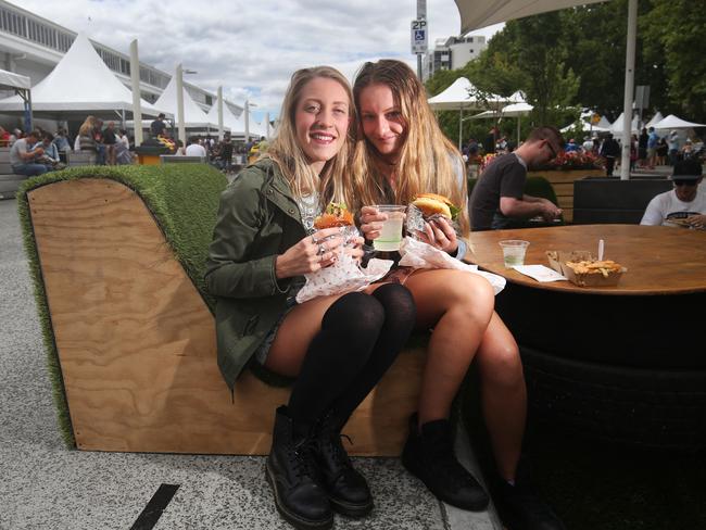 Townsville visitors Allison Waters, left, and Chantelle O'Connor sample the fare.