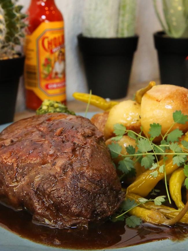 Beef cheeks with sauteed garlic potatoes, pickled guindilla chillies and chimichurri. Pic: Angelo Velardo/AAP Image