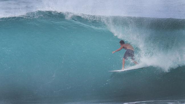 Cyclone Oma is agony for some and ecstasy for others. Surfers enjoy great waves at Kirra. Picture Glenn hampson