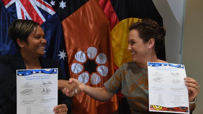 Labor's Selena Ubio and CLP leader Lia Finocchiaro sign the Aboriginal Justice Agreement. Picture: (A)manda Parkinson