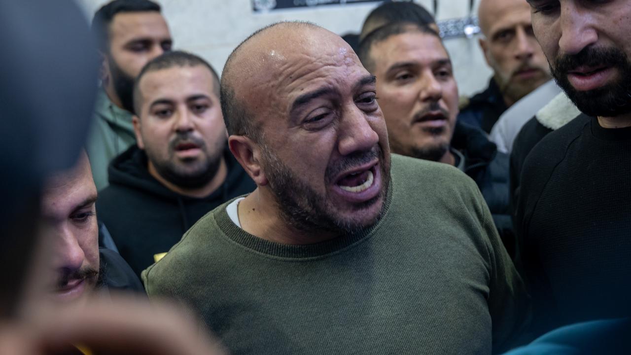 Relatives mourn over a body in Jenin, West Bank after a multi-day raid in the city by members of the Israeli Defense Forces (IDF) that left over 10 residents dead and wounded on December 14. Picture: Spencer Platt/Getty Images