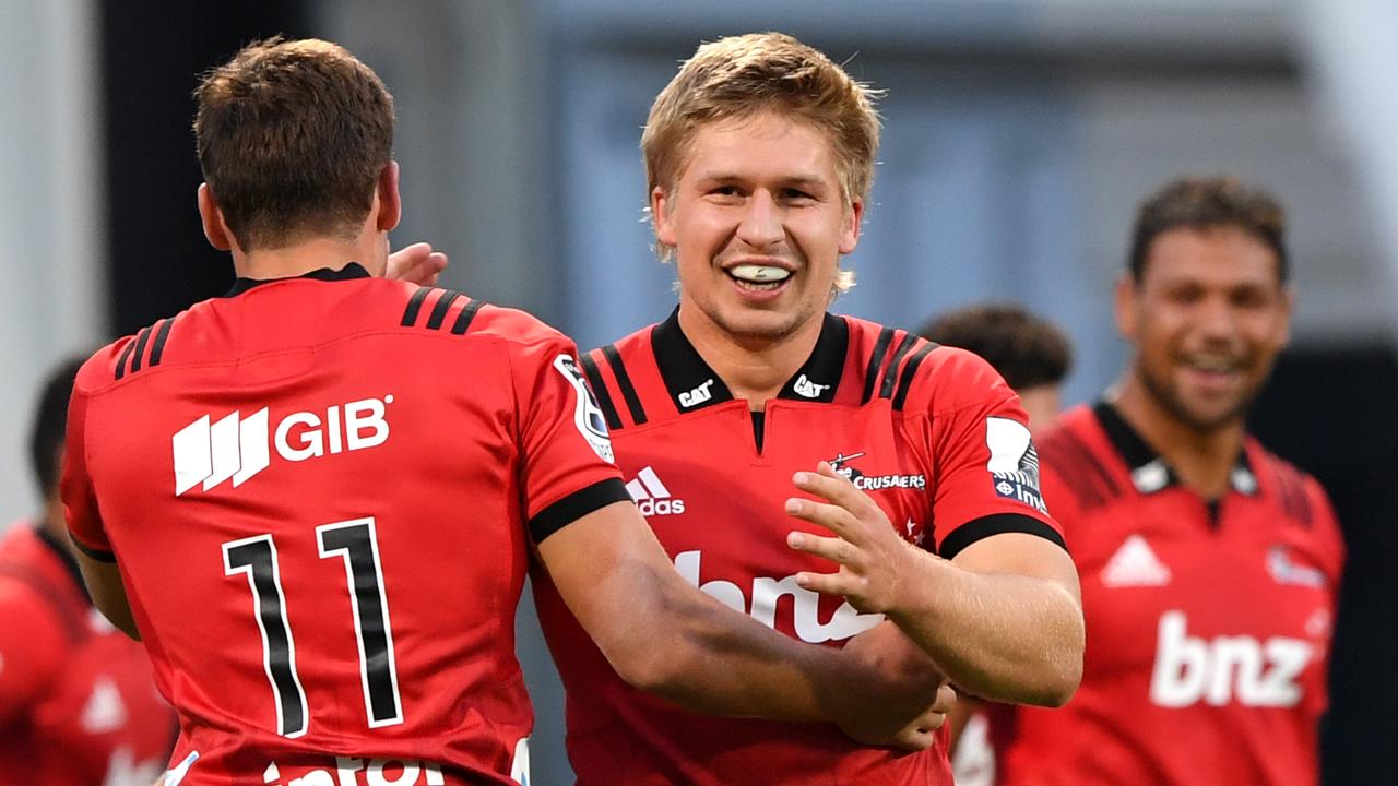 Jack Goodhue of the Crusaders celebrates after Richie Mo’unga scored a try.