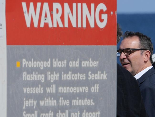 South Australian Liberal leader Steven Marshall walks past a warning sign as they leave a press conference in Port Jervis, Wednesday, March 14, 2018. (AAP Image/Tracey Nearmy) NO ARCHIVING,