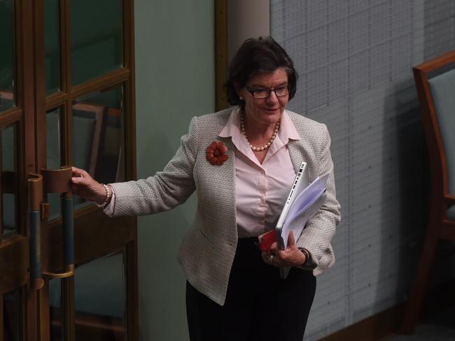 The member for Indi, Cathy McGowan, leaves during House of Representatives Question Time at Parliament House in Canberra, Thursday, Oct. 2, 2014. (AAP Image/Lukas Coch) NO ARCHIVING