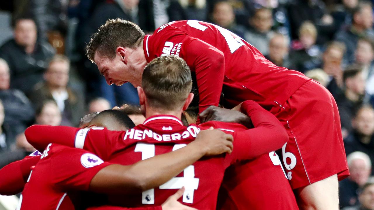 NEWCASTLE UPON TYNE, ENGLAND - MAY 04: Divock Origi of Liverpool celebrates with teammates after scoring his team's third goal during the Premier League match between Newcastle United and Liverpool FC at St. James Park on May 04, 2019 in Newcastle upon Tyne, United Kingdom. (Photo by Clive Brunskill/Getty Images)