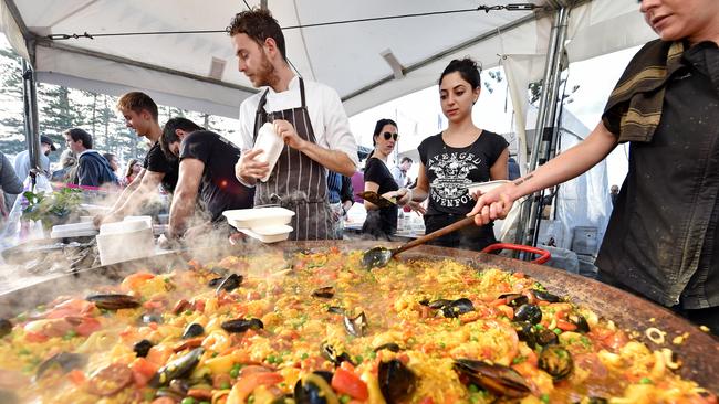 Larissa Marques from The Herring Room serving up seafood and chorizo paella last year. (AAP IMAGE / Troy Snook)