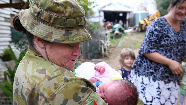 Australian Army medic Corporal Kristie Connell meets baby Ivy. Picture: ADF