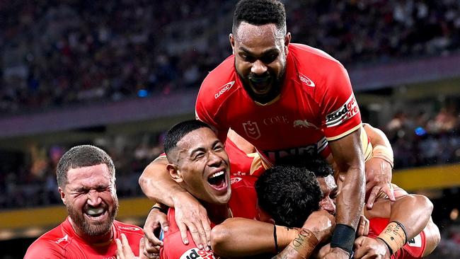 BRISBANE, AUSTRALIA - MAY 06: Valynce Te Whare of the Dolphins celebrates with his team mates after scoring a try during the round 10 NRL match between Cronulla Sharks and Dolphins at Suncorp Stadium on May 06, 2023 in Brisbane, Australia. (Photo by Bradley Kanaris/Getty Images)