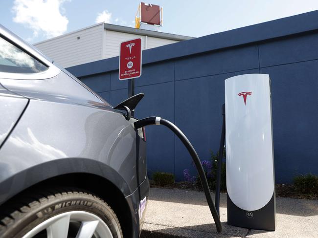 CORTE MADERA, CALIFORNIA - APRIL 26: A Tesla car charges at a Tesla Supercharger station on April 26, 2021 in Corte Madera, California. Tesla will report first quarter earnings today after the closing bell.   Justin Sullivan/Getty Images/AFP == FOR NEWSPAPERS, INTERNET, TELCOS & TELEVISION USE ONLY ==