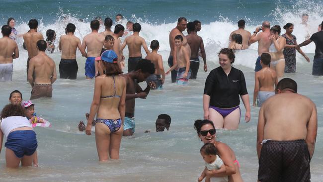 Crowds try to cool off in Surfers Paradise. Picture: Mike Batterham