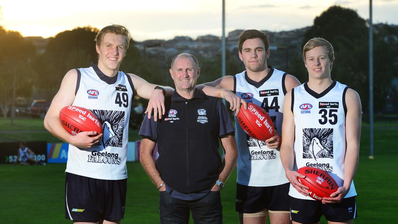 Michael Turner with Falcons players Hugh Goddard, Patrick McCartin and Jackson Nelson in 2014. Picture: Mitch Bear