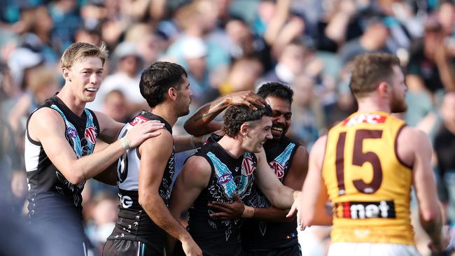 ADELAIDE, AUSTRALIA - JUNE 03: Darcy Byrne-Jones of the Power celebrates a goal with team mates during the 2023 AFL Round 12 match between the Port Adelaide Power and the Hawthorn Hawks at Adelaide Oval on June 3, 2023 in Adelaide, Australia. (Photo by Sarah Reed/AFL Photos via Getty Images)