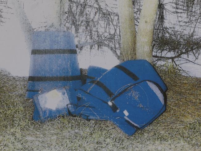 An image shown to court of cash bags and documents, stolen from Lane Cove Chubb, found in the Cooks River at Marrickville.