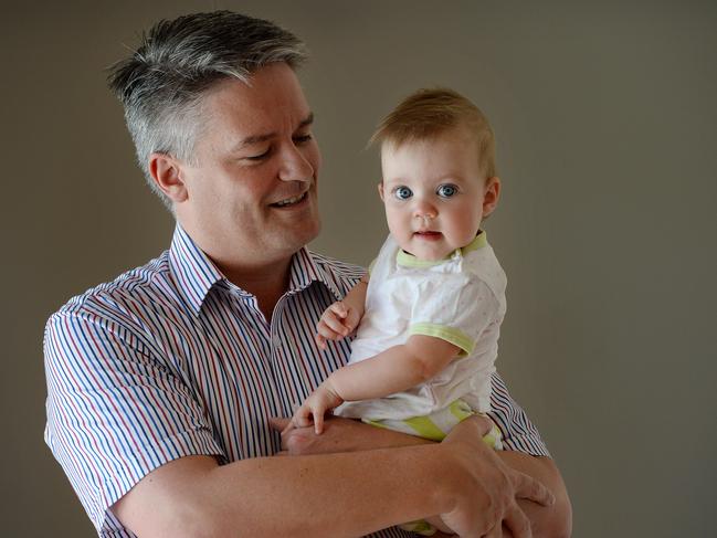 Cormann holding daughter Isabelle.