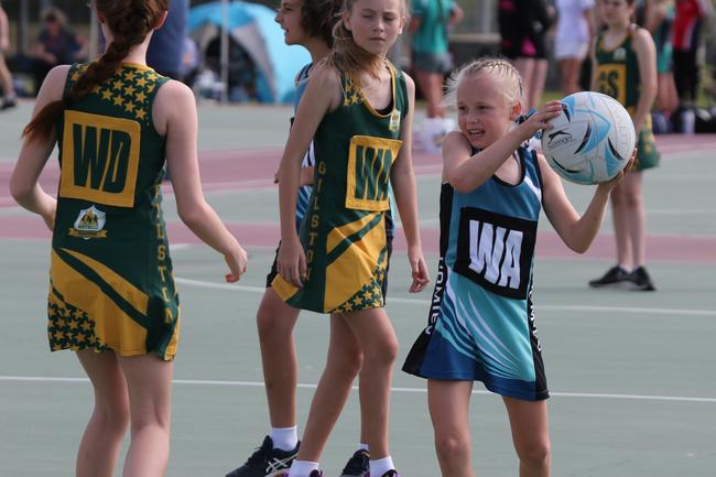 The Netball Qld Primary Schools Cup grand finals are being held at the Hinterland District Netball Association at Mudgeeraba. Homies (home schooled kids) player Tasmin McGree in action against Gilston. Picture: Mike Batterham.