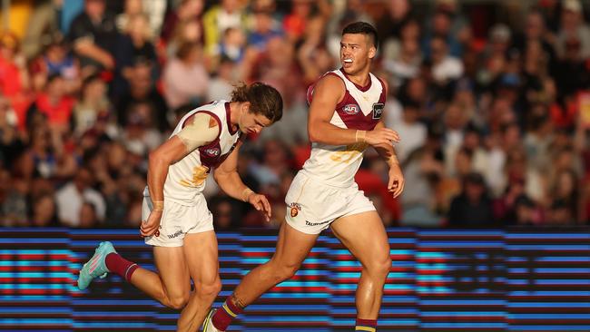 Cam Rayner celebrates a goal in Brisbane’s win over the Suns. Picture: Chris Hyde/Getty Images