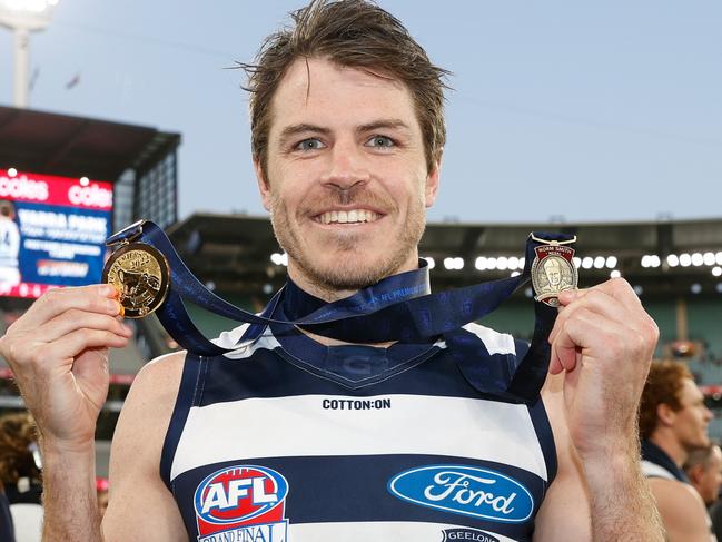 MELBOURNE, AUSTRALIA - SEPTEMBER 24: Isaac Smith of the Cats poses with his Norm Smith Medal and Premiership Medal during the 2022 Toyota AFL Grand Final match between the Geelong Cats and the Sydney Swans at the Melbourne Cricket Ground on September 24, 2022 in Melbourne, Australia. (Photo by Michael Willson/AFL Photos via Getty Images)