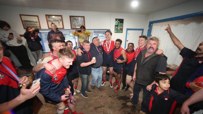 Swifts Creek players and support staff celebrate after the win against Omeo-Benambra.