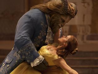 This image released by Disney shows Dan Stevens as The Beast, left, and Emma Watson as Belle in a live-action adaptation of the animated classic "Beauty and the Beast." (Disney via AP)