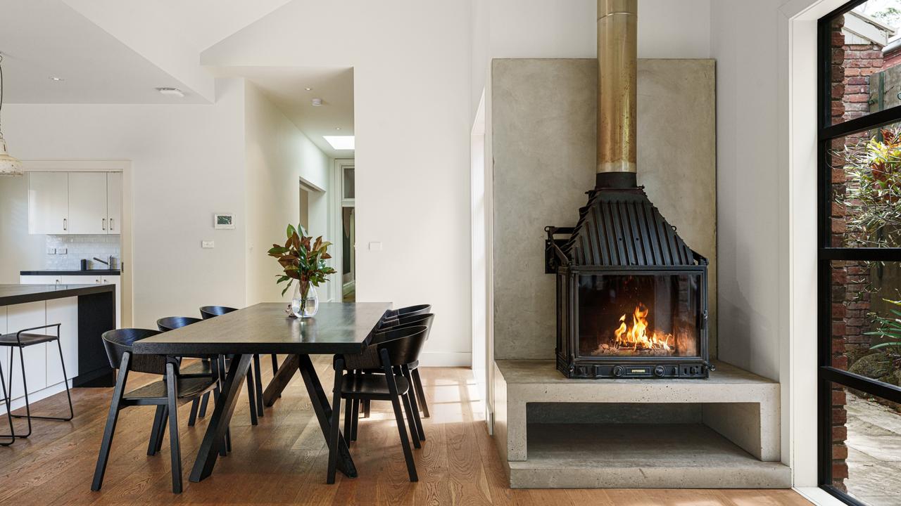 A roaring fireplace in the open-plan dining and living area.