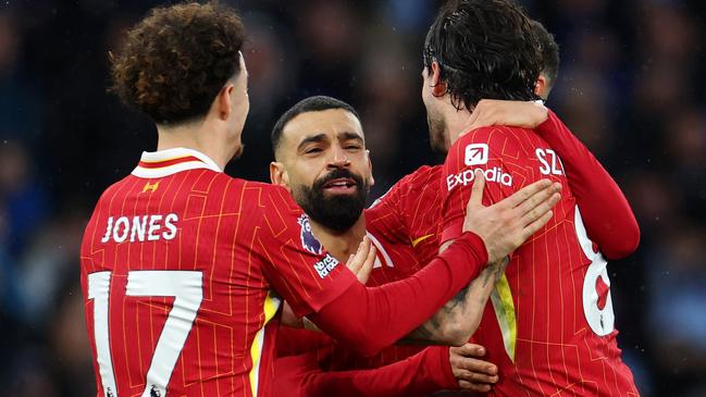 MANCHESTER, ENGLAND - FEBRUARY 23: Dominik Szoboszlai of Liverpool celebrates scoring his team's second goal with teammates Curtis Jones and Mohamed Salah during the Premier League match between Manchester City FC and Liverpool FC at Etihad Stadium on February 23, 2025 in Manchester, England. (Photo by Alex Pantling/Getty Images)