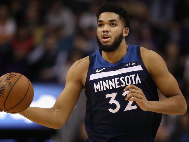 (FILES) In this file photo Karl-Anthony Towns #32 of the Minnesota Timberwolves handles the ball during the first half of the NBA game against the Phoenix Suns at Talking Stick Resort Arena on January 22, 2019 in Phoenix, Arizona. - Minnesota Timberwolves center Karl-Anthony Towns said Monday February 25, 2019 he was lucky to have escaped with his life after the car crash last week which forced him out of two games. The 23-year-old suffered a suspected concussion following the incident on February 21, and told reporters ahead of his return from injury against Sacramento later on Monday that his car was struck from behind by a truck which had failed to brake in time after his car had come to a stop. (Photo by Christian Petersen / GETTY IMAGES NORTH AMERICA / AFP)