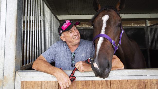 Trainer Rob Heathcote and Rothfire at Eagle Farm Racecourse. (AAP Image/Attila Csaszar)