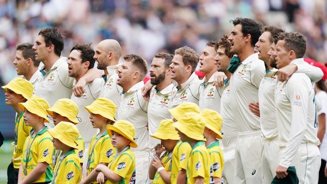 Australian players sing their national anthem on day 1 of the Boxing Day Test match between Australia and New Zealand at the MCG in Melbourne, Thursday, December 26, 2019. (AAP Image/Michael Dodge) NO ARCHIVING, EDITORIAL USE ONLY, IMAGES TO BE USED FOR NEWS REPORTING PURPOSES ONLY, NO COMMERCIAL USE WHATSOEVER, NO USE IN BOOKS WITHOUT PRIOR WRITTEN CONSENT FROM AAP