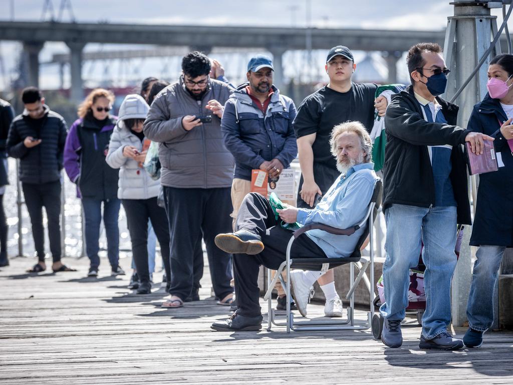 Voters encounter a long wait at a polling centre at the Docklands Library in Melbourne. Picture: Jake Nowakowski