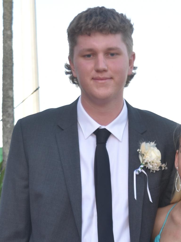 Dempsey Hall from Pacific Lutheran College would’ve taken some inspiration from David Hasselhoff for this stellar mullet at his formal. Picture: Sam Turner