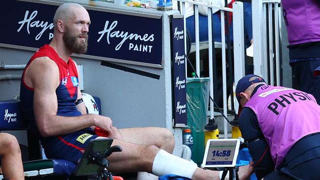 MELBOURNE, AUSTRALIA - JULY 07: Max Gawn of the Demons receives attention during the round 17 AFL match between Melbourne Demons and West Coast Eagles at Melbourne Cricket Ground on July 07, 2024 in Melbourne, Australia. (Photo by Graham Denholm/AFL Photos/via Getty Images)