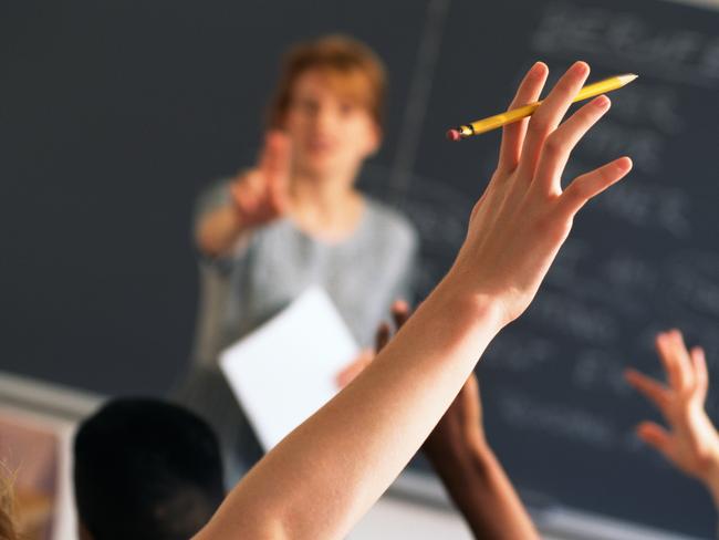 Teacher pointing to raised hands in classroom, Classroom, teaching generic, education generic, Teacher, Learning, Hand Raised, Education, Adult, School Building, Pointing, Standing, Image, Women, Adults Only, Colour Image, Horizontal, Human Arm, Human Body Part, Human Limb, Incidental People, Indoors, Limb, One Person, Only Women, People, Photography, thinkstock, generic, istock