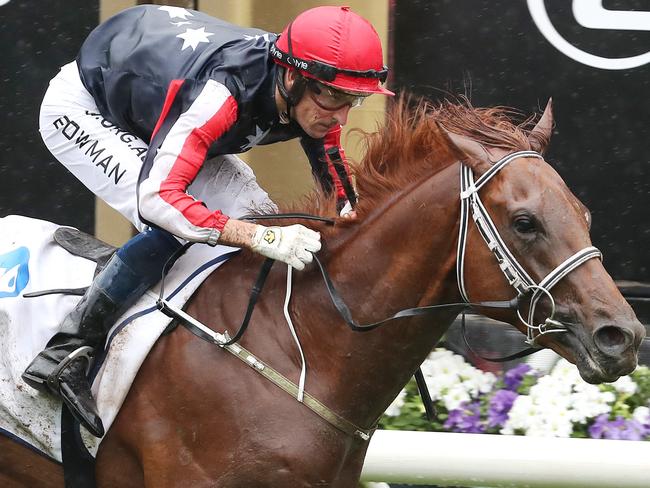 Victoria Derby Day races at Flemington. 02/11/2019. Race 3. The Carbine Club Stakes over 1600 meters.  Dalasan ridden by Hugh Bowman (red cap) beats home Brandenburg ridden by Dwayne Dunn (blue and green cap) to win the 3rd   . Pic: Michael Klein