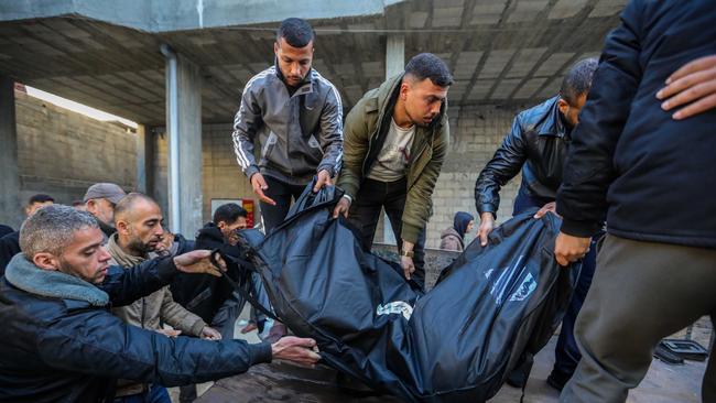 Bodies of victims of an Israeli strike are unloaded in Rafah. Picture: Getty Images