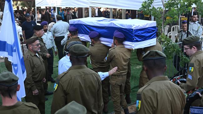 The coffin of Sergeant Kiril Brodski, a 19-year-old Israeli soldier who was killed on October 7 and his body then taken to Gaza, is seen during his funeral at the Kiryat Shaul Cemetery.