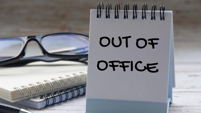 Out of office text on calendar desk with notebook and glasses background. Out of office concept. Picture: iStock