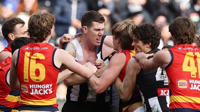 MELBOURNE - June 25 : AFL. Mason Cox of the Magpies runs at Josh Worrell of the Crows after kicking a goal in the 4th qtr starting a melee during the round 15 AFL match between Collingwood and Adelaide at the MCG on June 25, 2023, in Melbourne. Photo by Michael Klein.