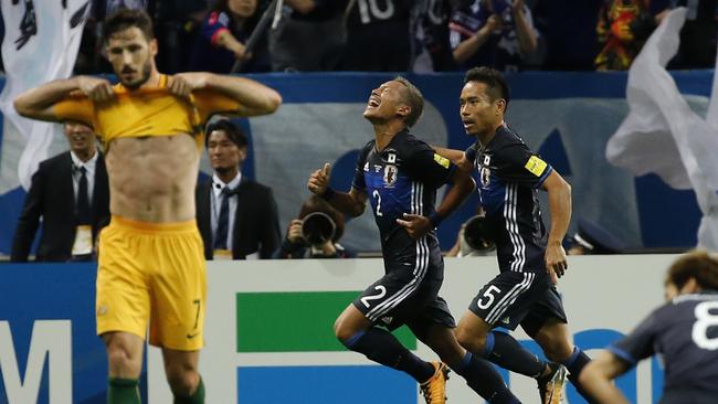 Japan's Yosuke Ideguchi (2) celebrates after scoring a goal.