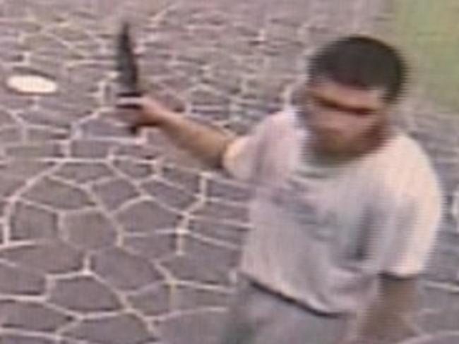 Ihsas Khan, brandishing a knife at the scene / Picture: A Current Affair/9 NEWS