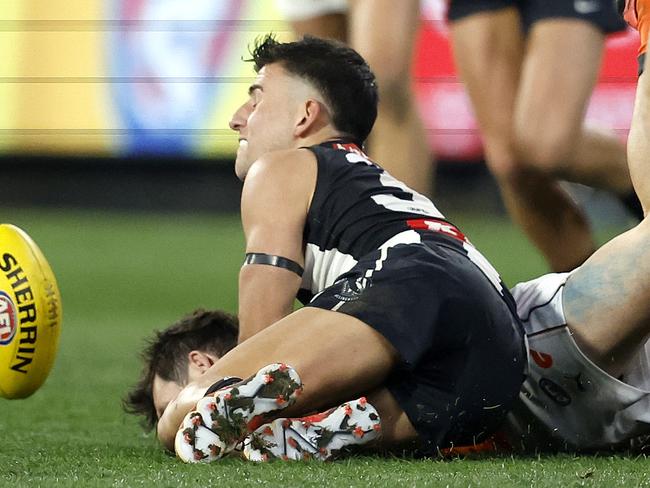 Collingwood's Nick Daicos drives Giants Brent Daniels into the ground during the AFL Preliminary Final match between the GWS Giants and Collingwood Magpies at the MCG on September 22, 2023.  Photo by Phil Hillyard(Image Supplied for Editorial Use only - **NO ON SALES** - Â©Phil Hillyard )